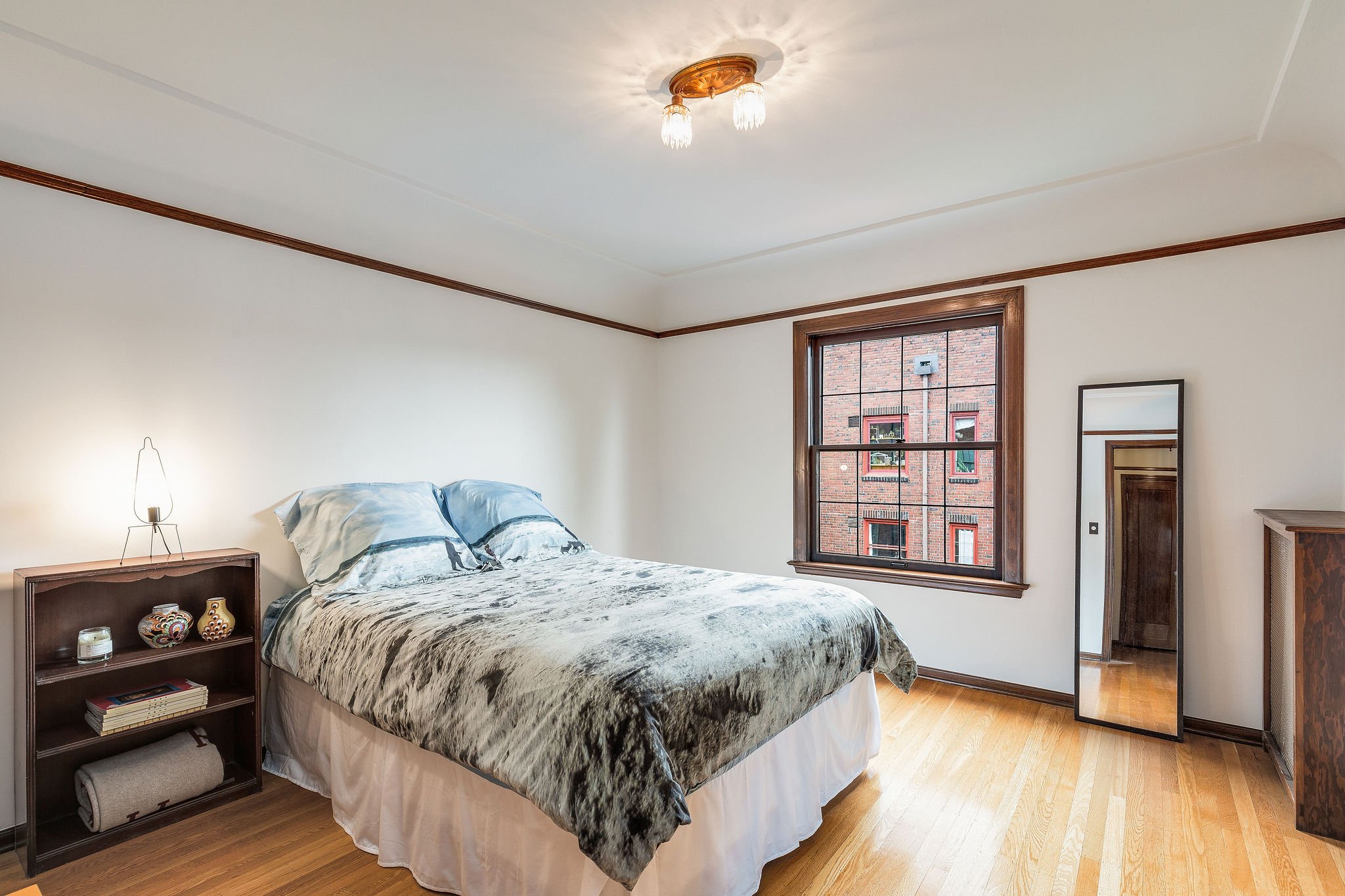 The 788 sqft home allows for a large bedroom that can easily accommodate a king-sized bed. All original light fixtures are in beautiful shape throughout the home. 