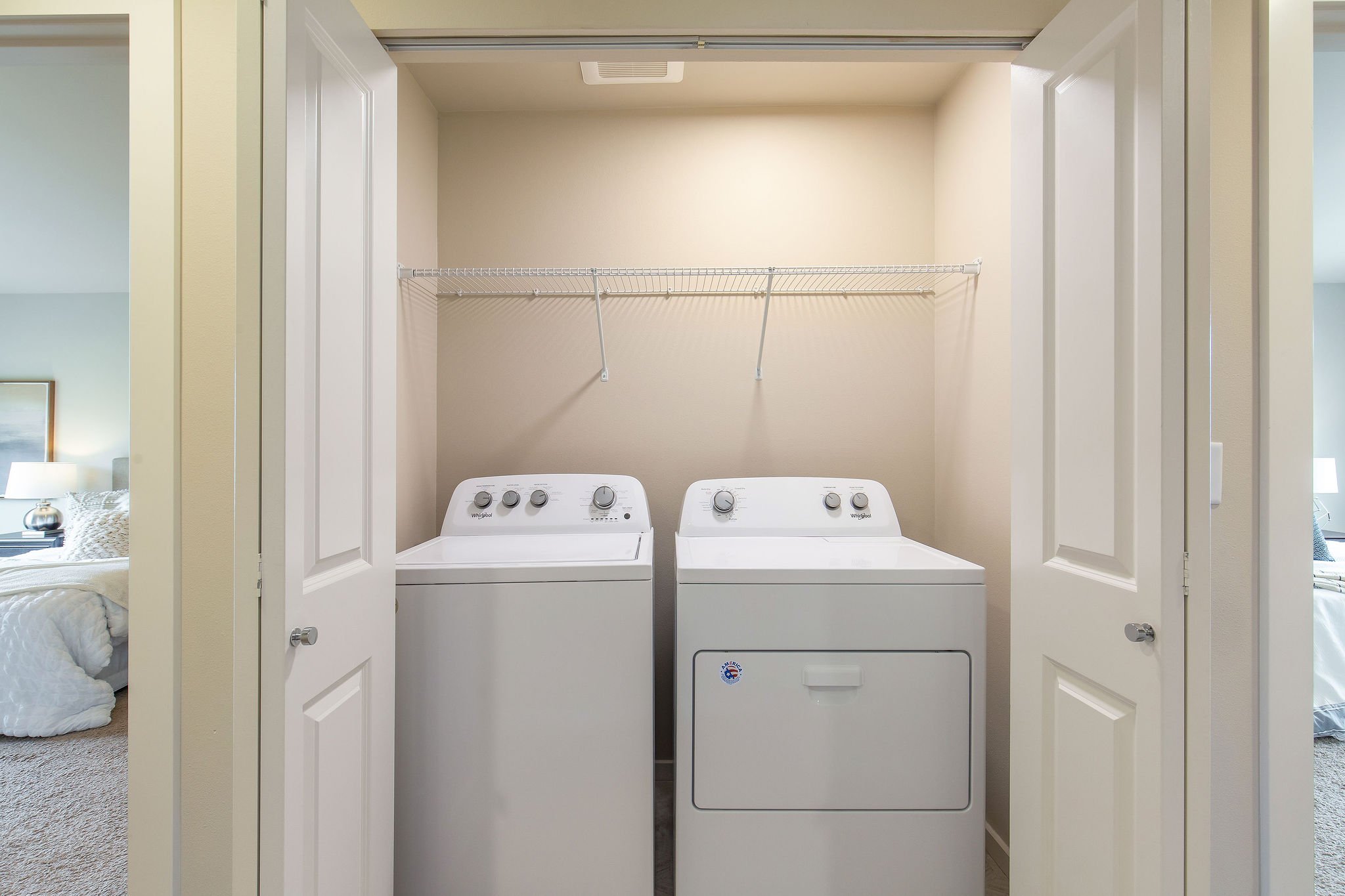  image description: interior of storage closet with washer and dryer 