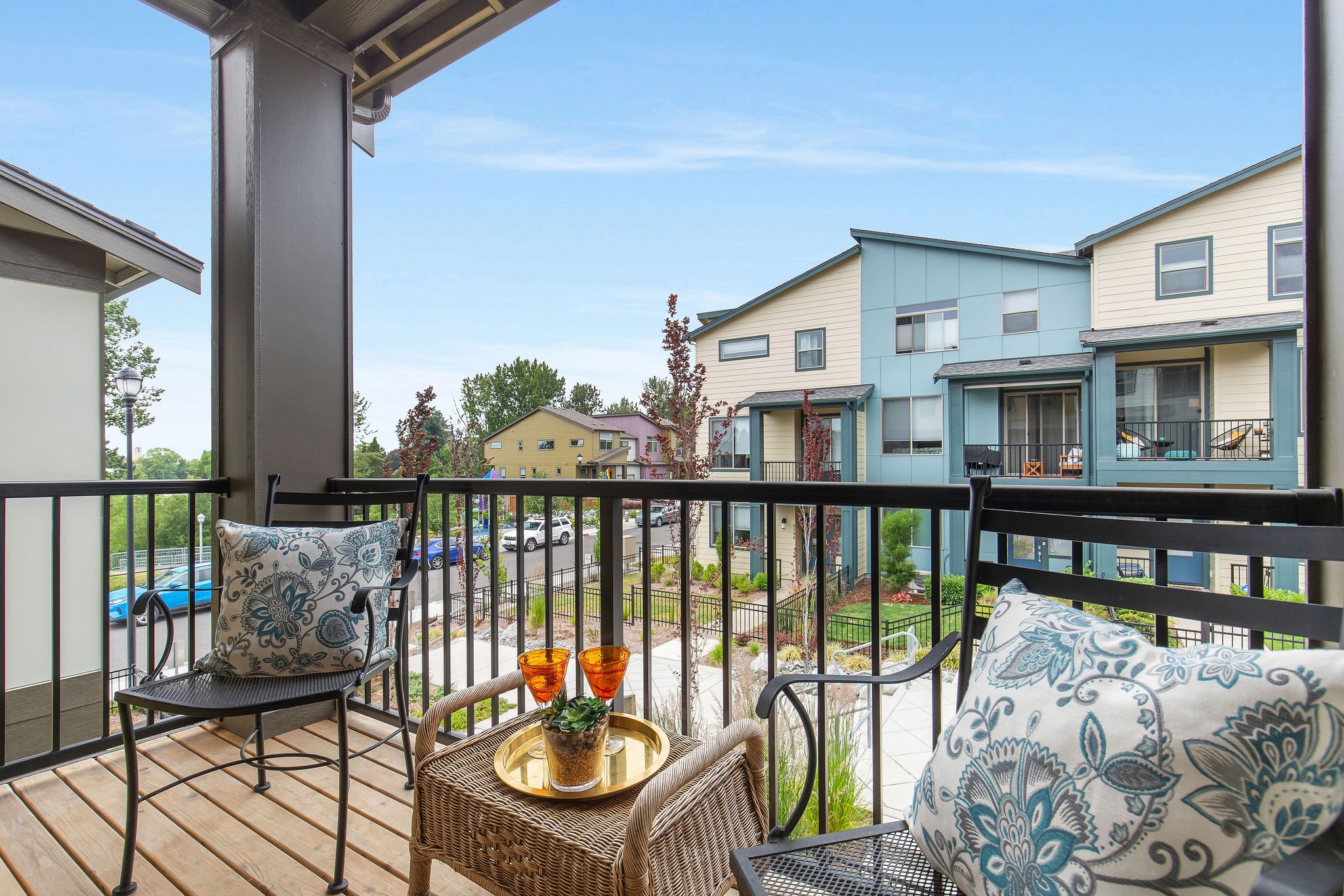  image description: balcony with outdoor chairs and table 