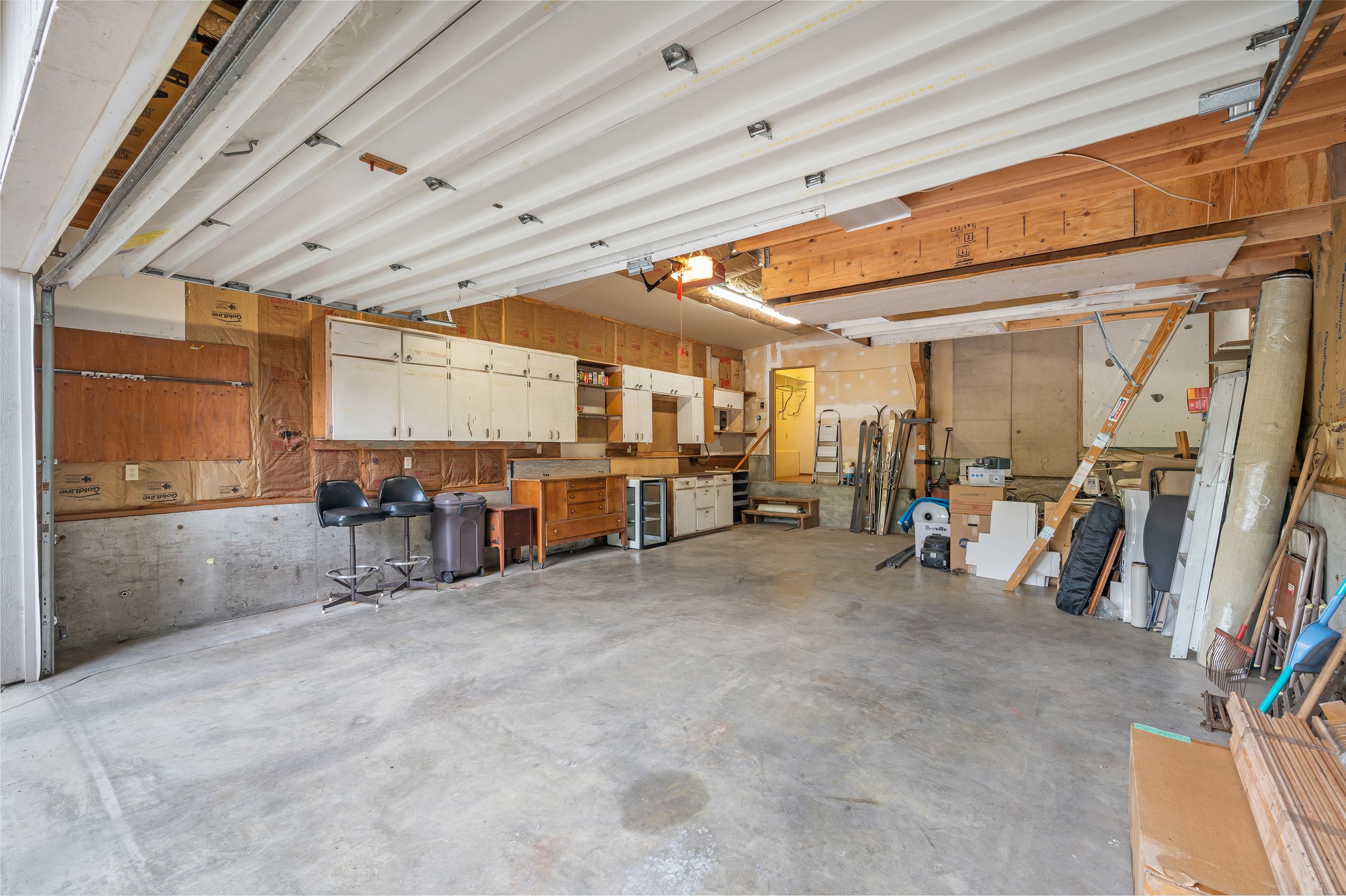  interior of garage with cabinets, storage and work station 