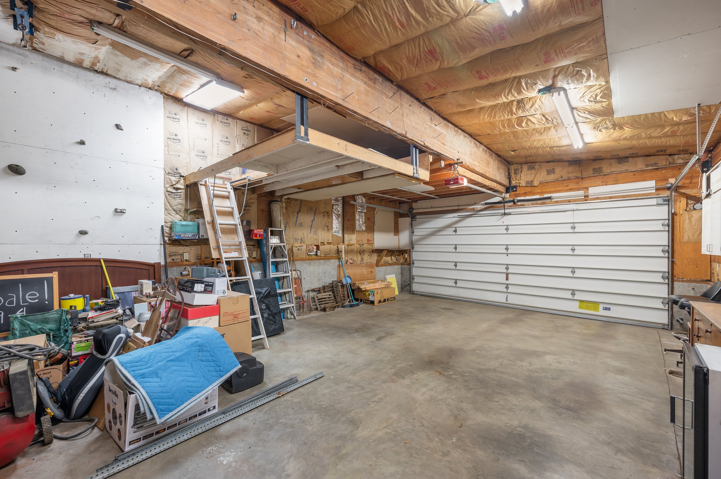  interior of garage with cabinets, storage and work station 
