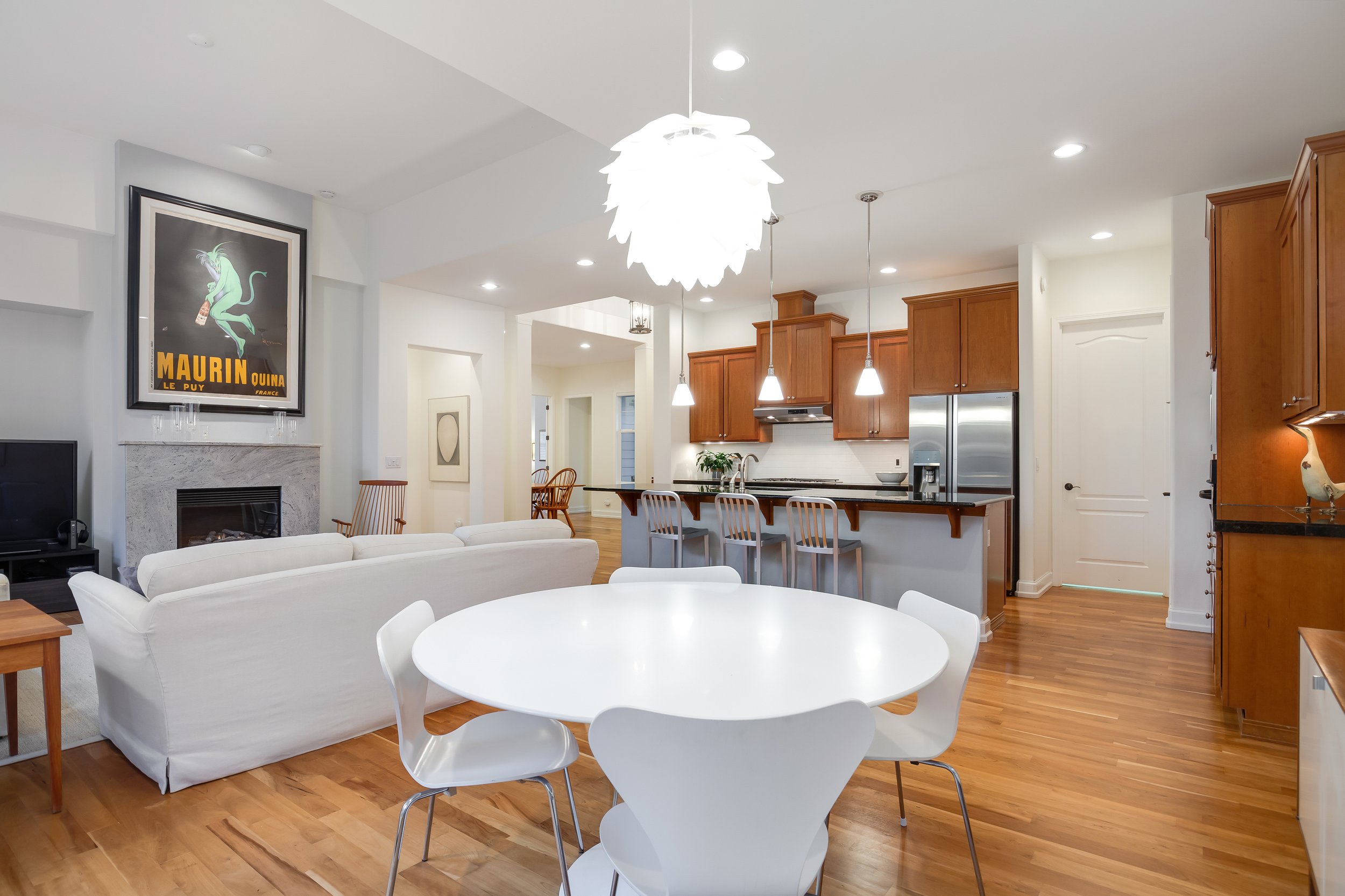  interior of dining room  with hardwood floors, dining table, and french doors 