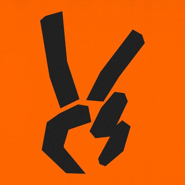 Black abstract hand gesture resembling the peace sign on an orange background.