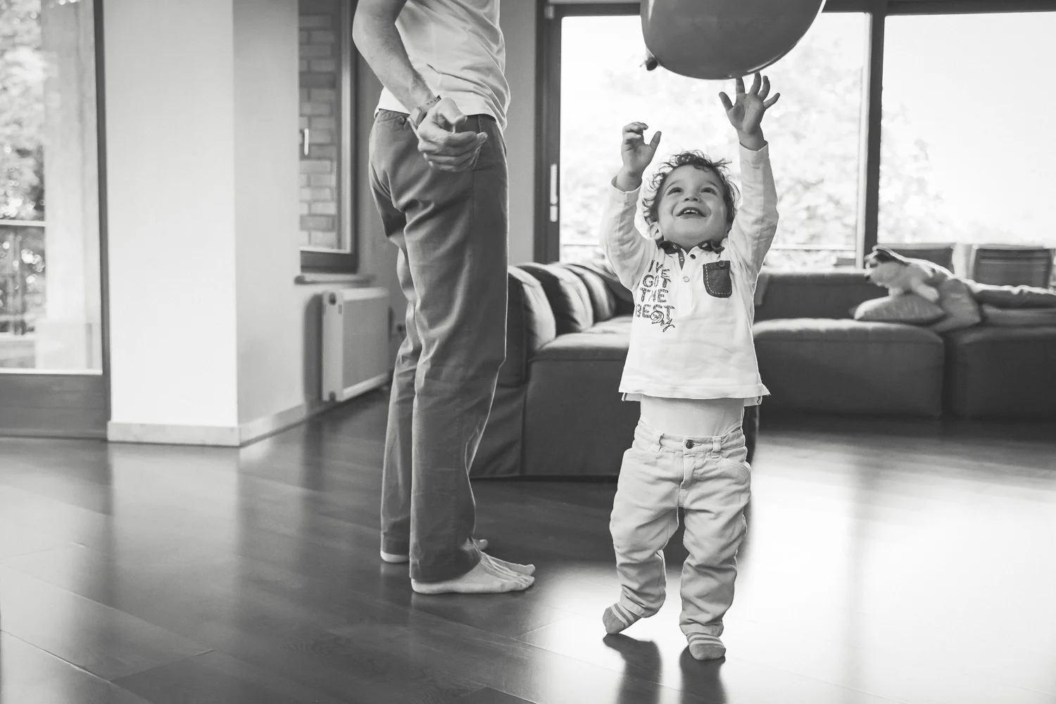 Toddler Chasing Baloon in Living Room.jpg