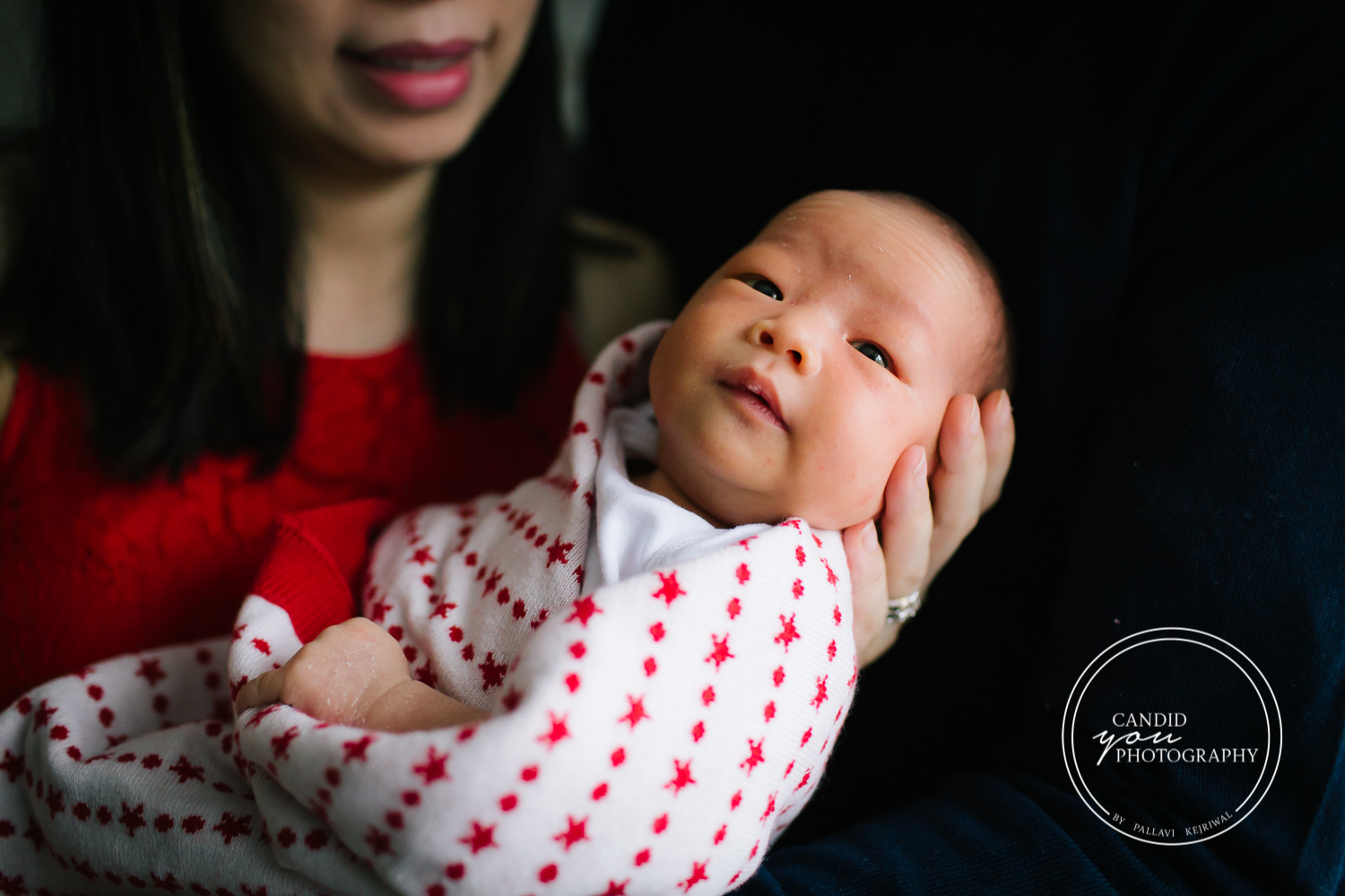 Chinese Newborn baby girl in red blanket