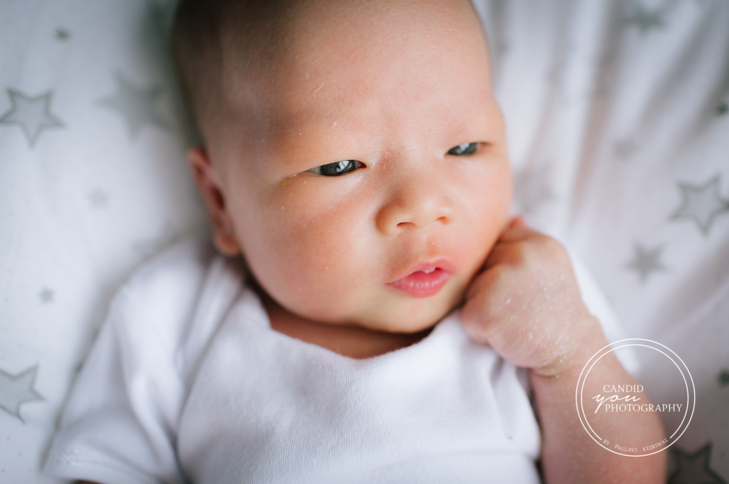 Birmingham Asian Newborn Baby Girl with hand on chin