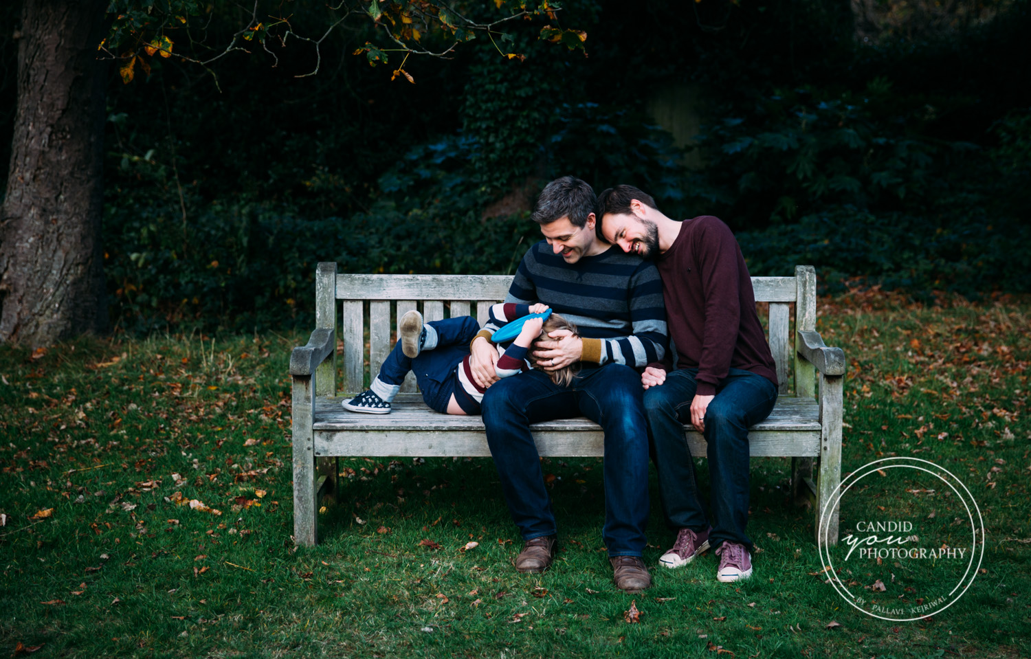 LGBTQ Dads lovingly look towards their son
