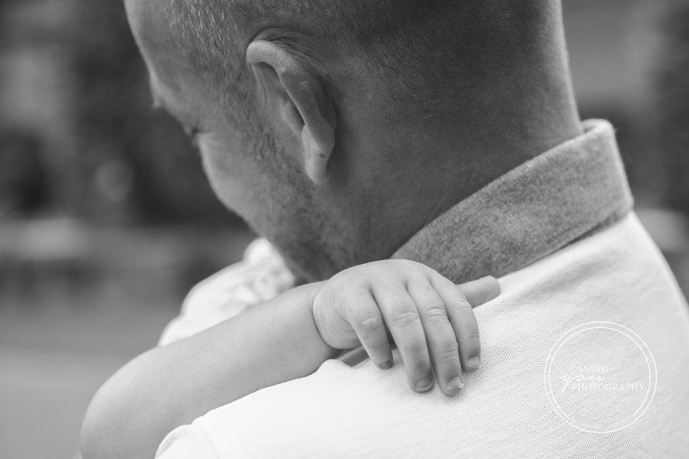 boy hugs dad and snuggles lovingly