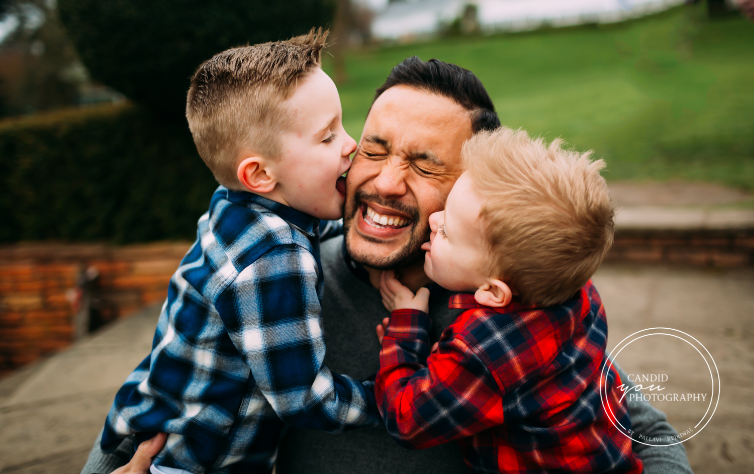 boys lick fathers face joyously
