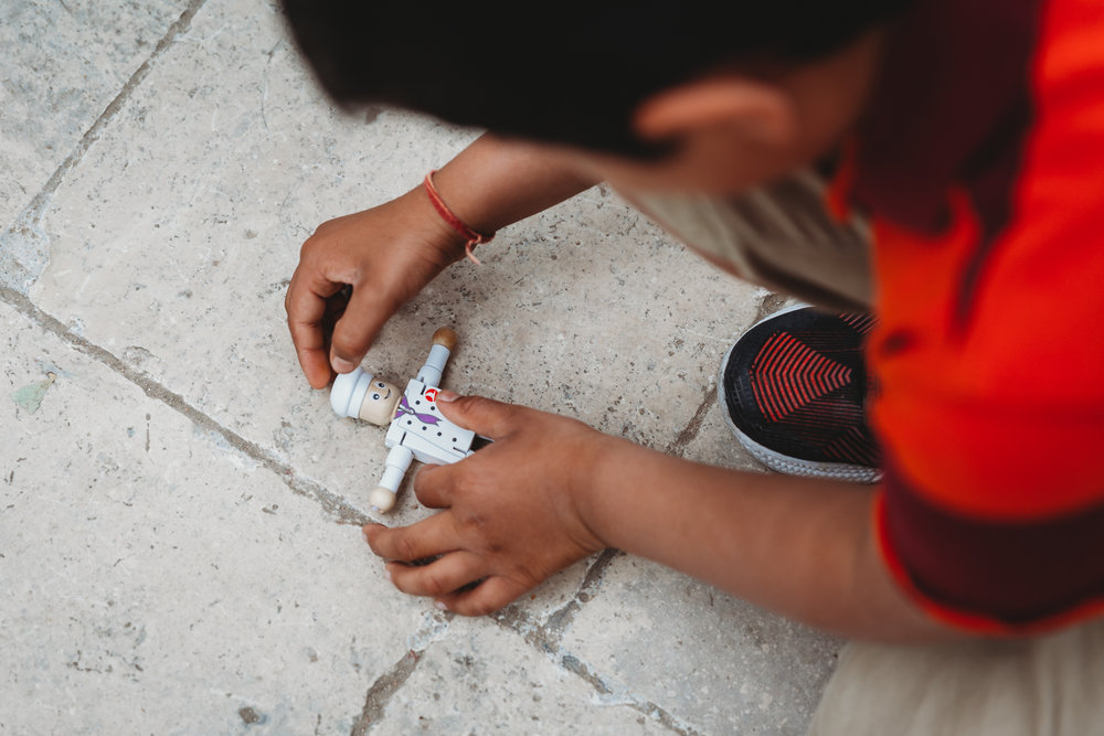 boy playing with a figurine