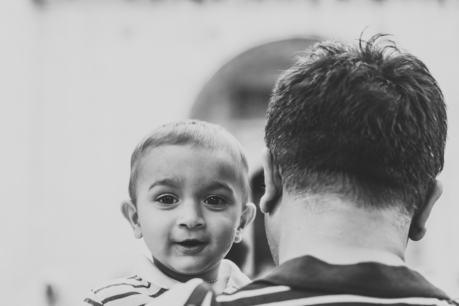 boy with his dad looking at the camera