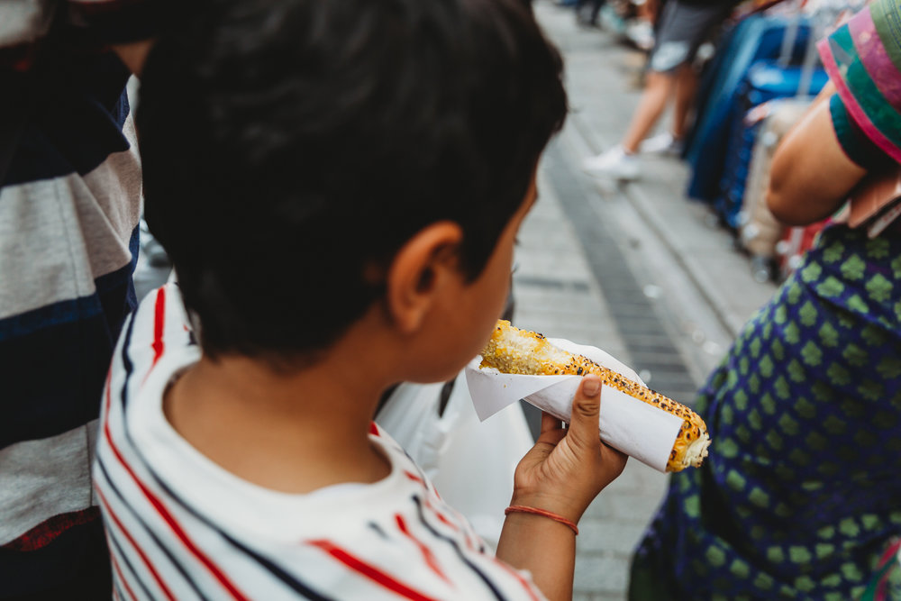 boy eating sauteed corn