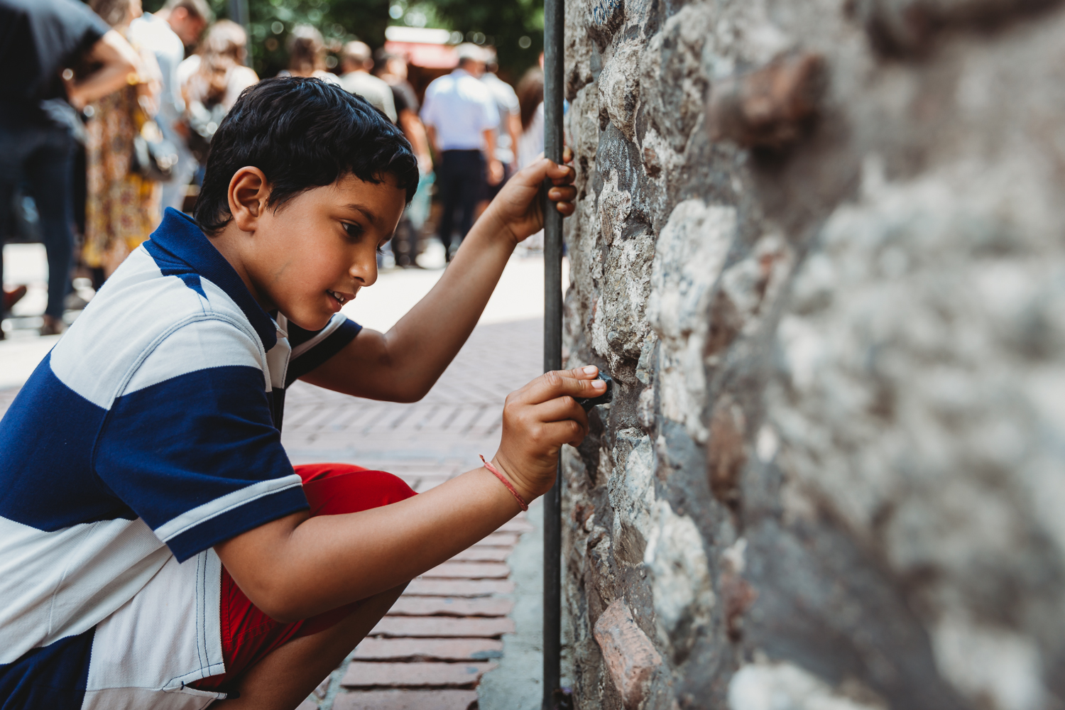 boy writing on the wall