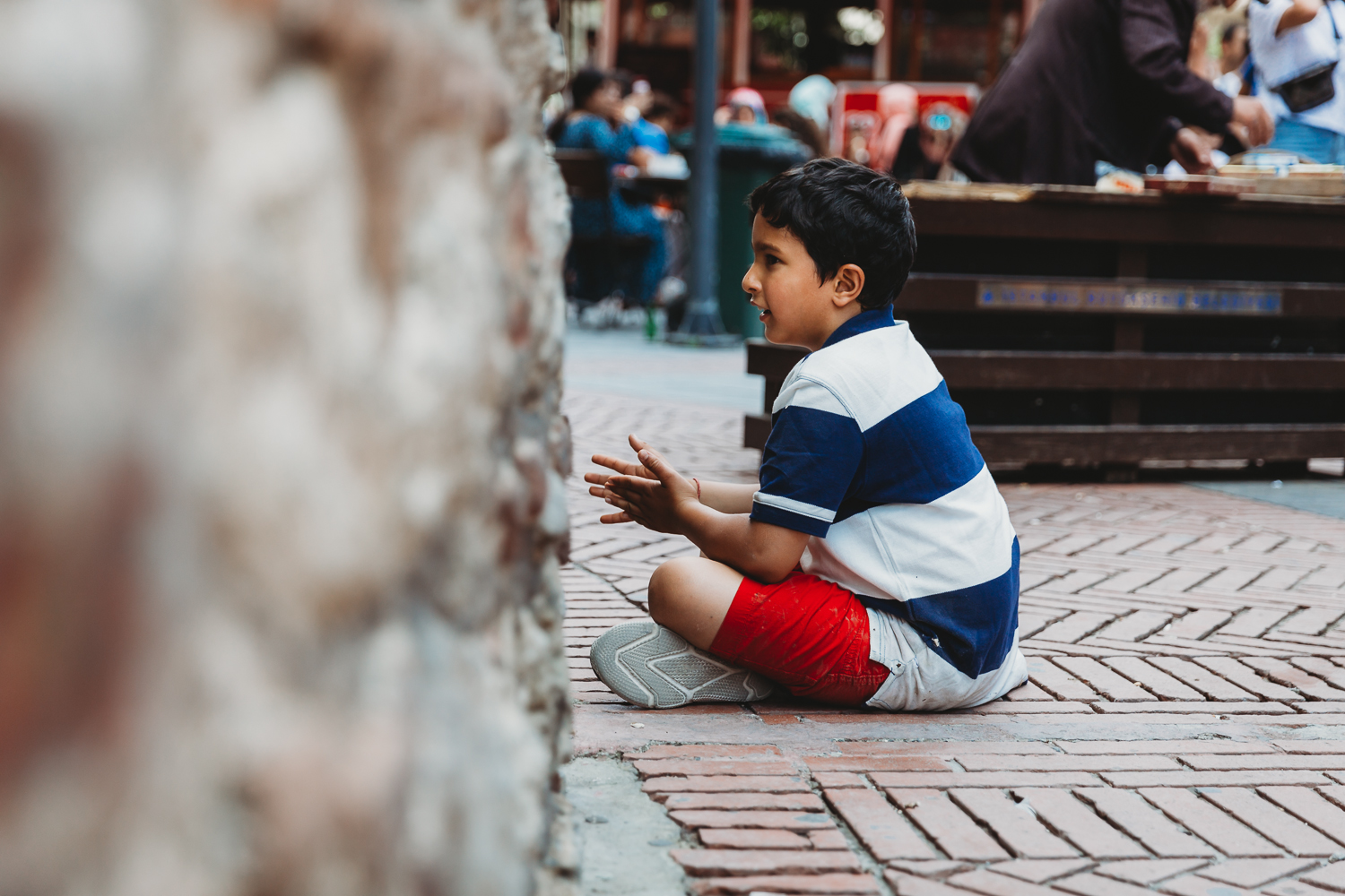 boy staring at the wall of galata tower