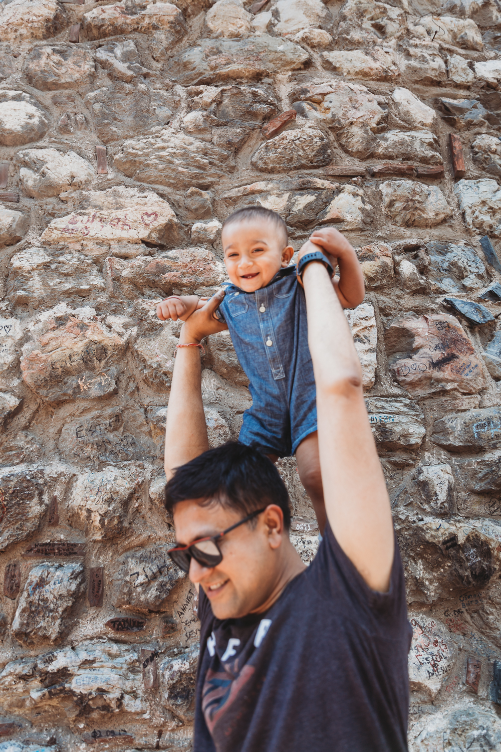 boy enjoying with dad in front of galata tower istanbul