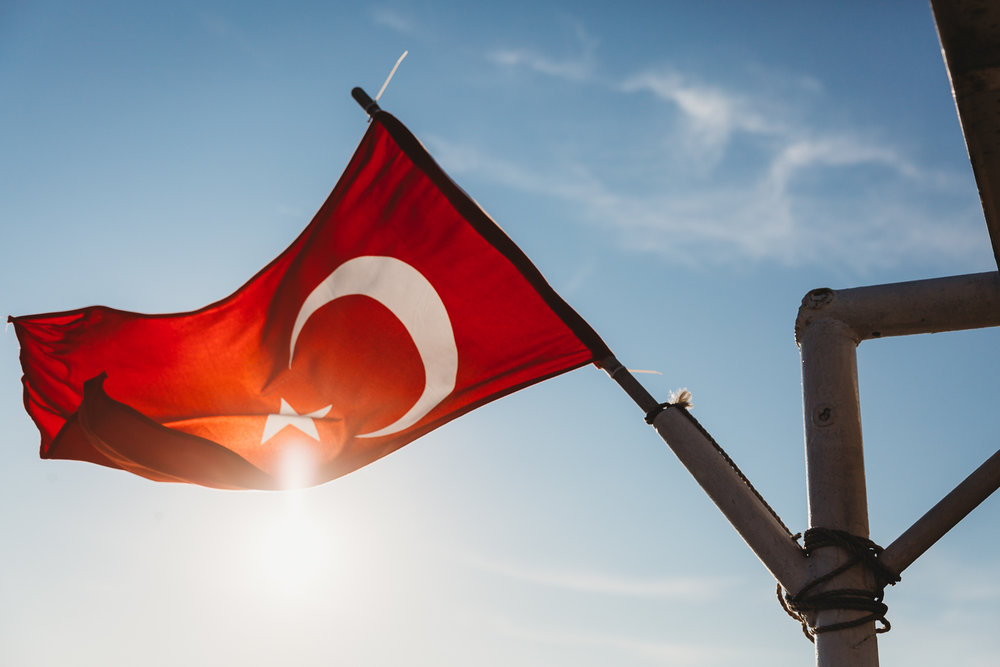 flag of turkey against the shining sun