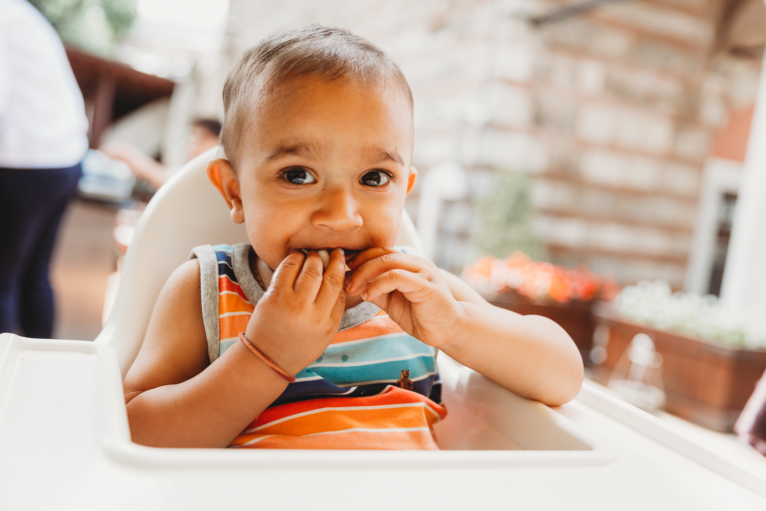 one year old boy in colourful t shirt