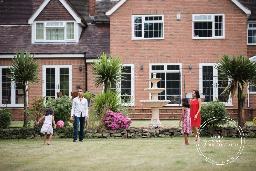 family enjoying in garden during in home family photo session