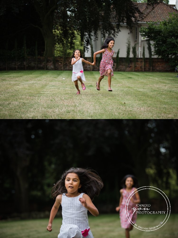 girls enjoying and running in their backyard during in home family photo session