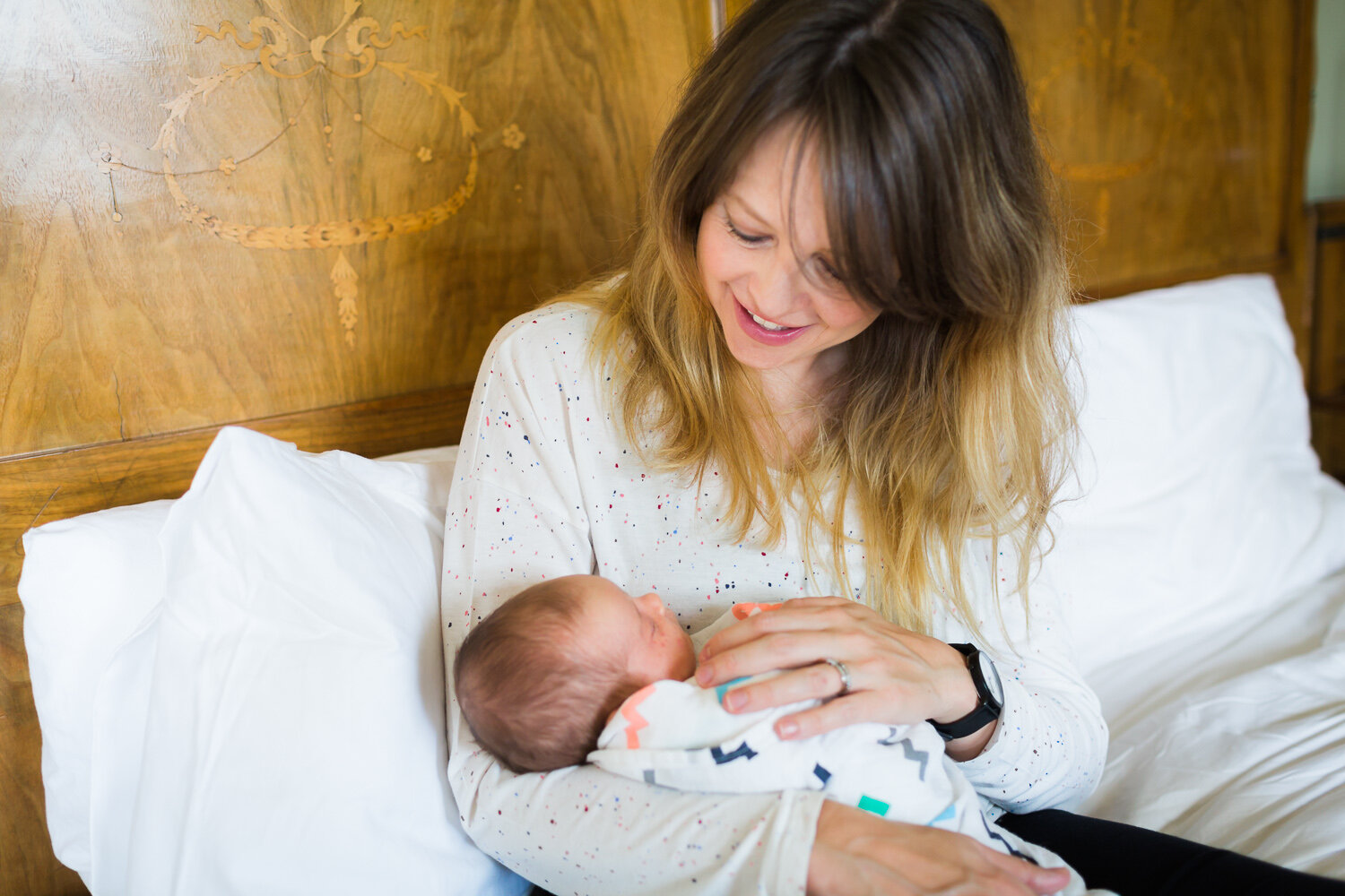 mum cuddling newborn in edgbaston