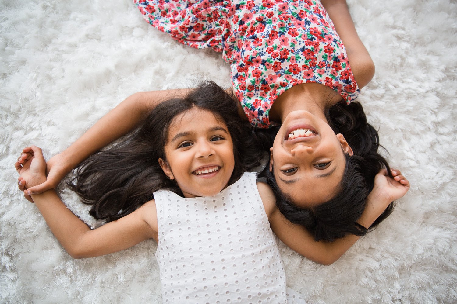 Wimbledon Family Photographer captures sisters having fun at home