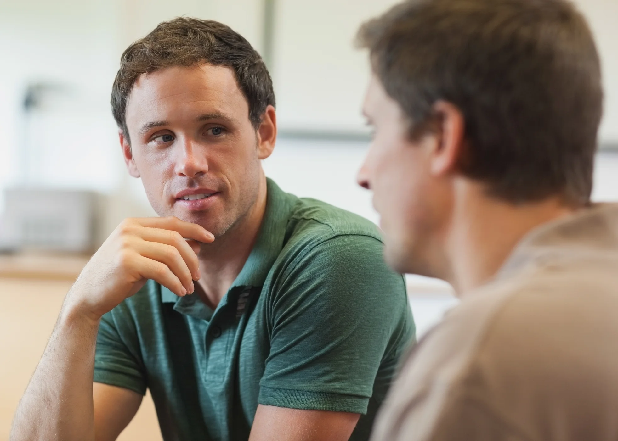 Two handsome mature students having a conversation