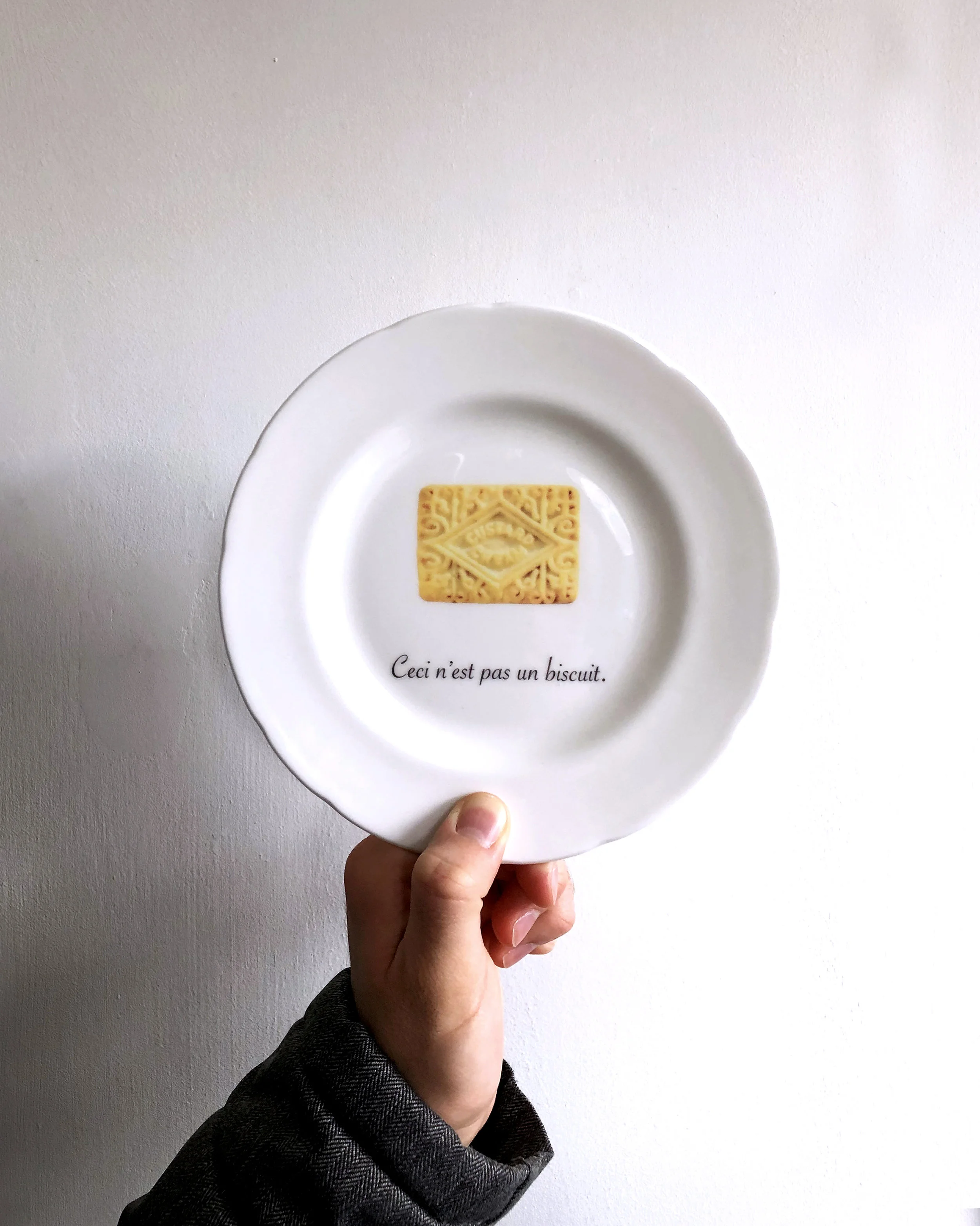 Ceci n'est pas un biscuit - custard cream on a fine English bone china plate by TIME AND TOAST