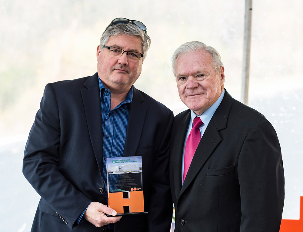 L2P Senior Design Principal Bob Little standing with Andy Washabaugh, a director at the Henderson Group.