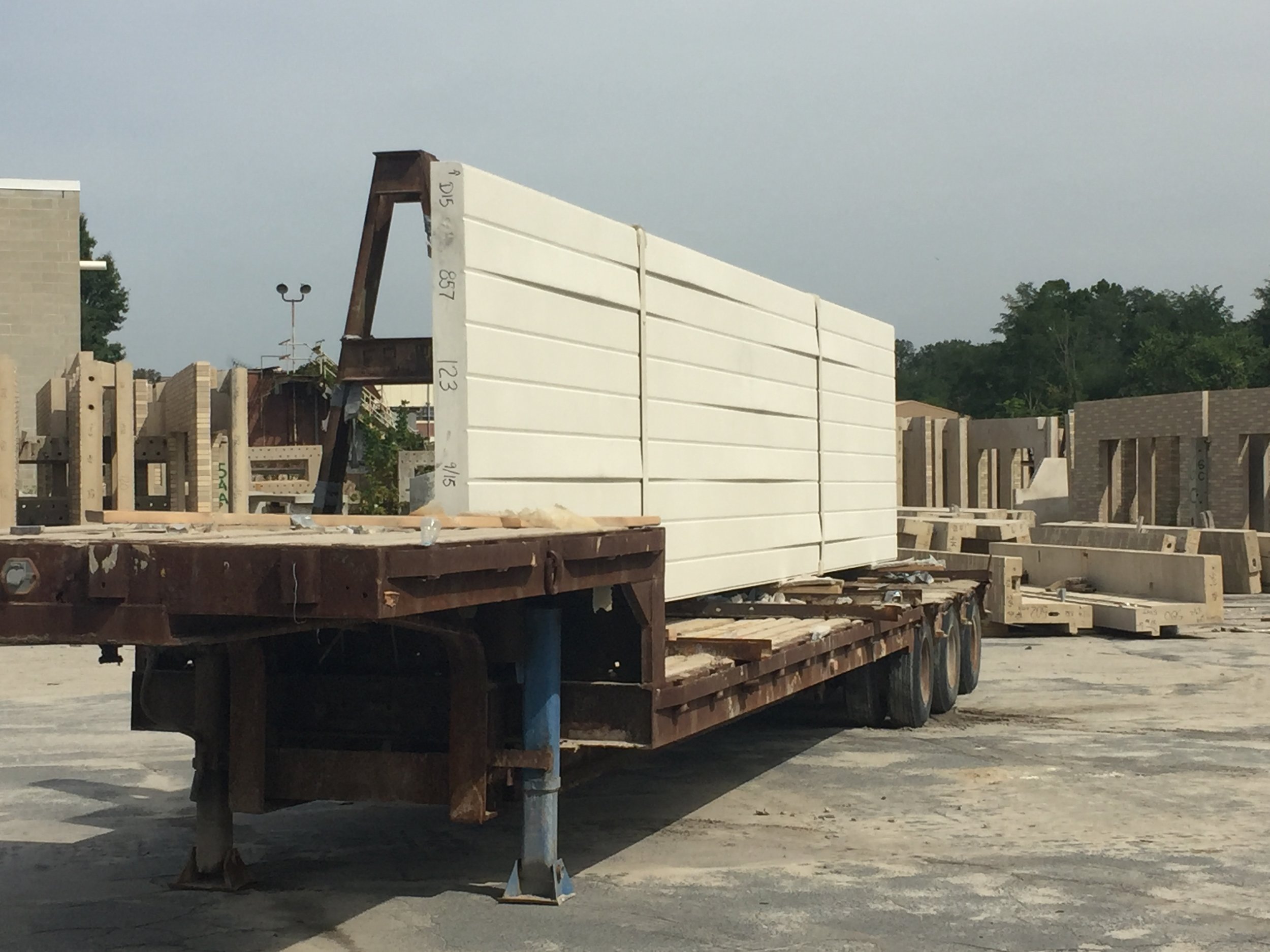 Precast panel on truck prepared for delivery.