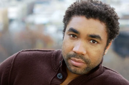 Edward+O'Blensi+Headshot+Sweater.jpg