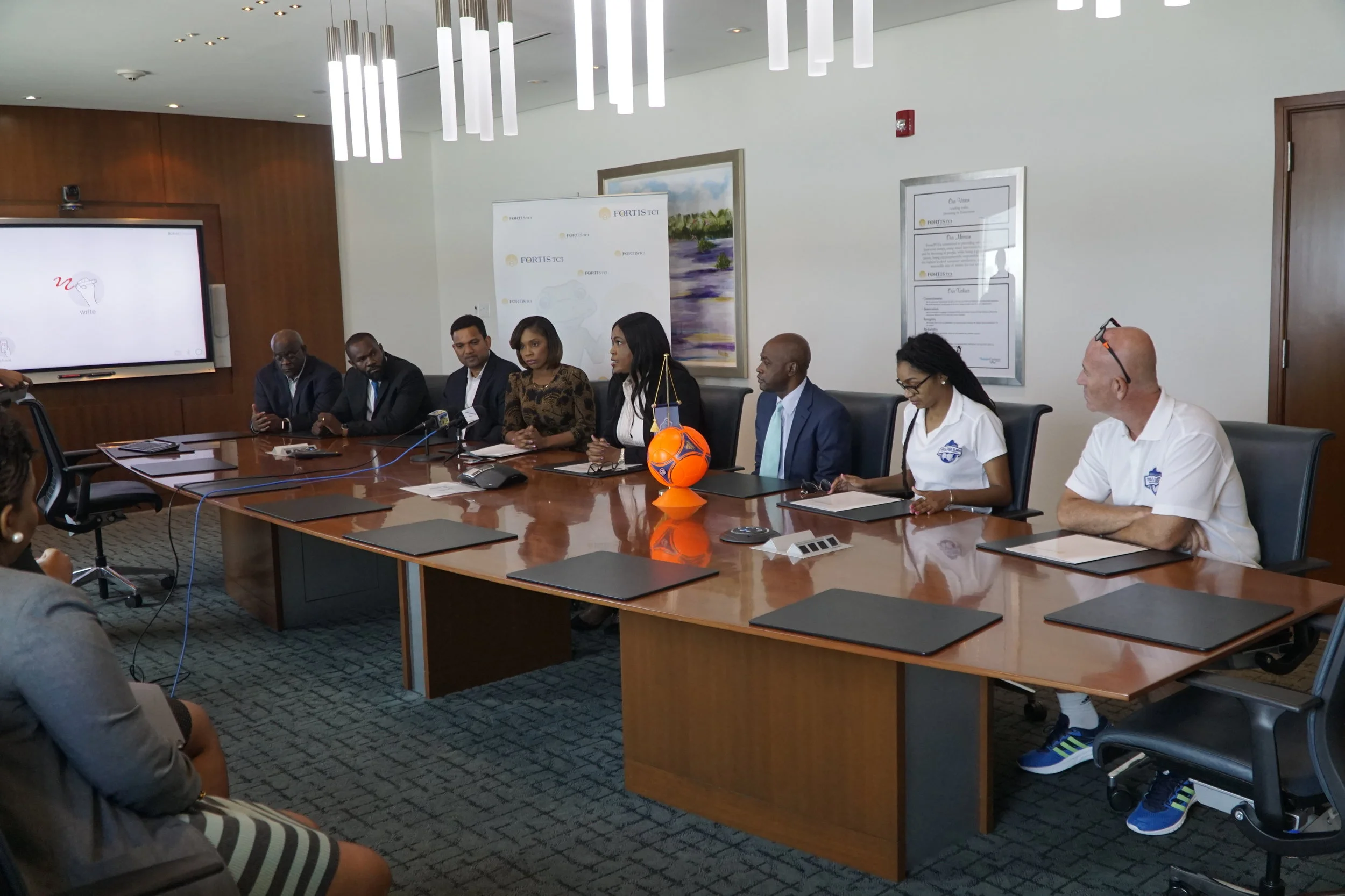 Contract Signing (L-R) Allan Robinson, Devon Cox, Nigel Hosein, Ruth Forbes, Eddinton Powell, Sonia Bien- Aime, Oliver Smith, Candia Ewing, Darren Meehan