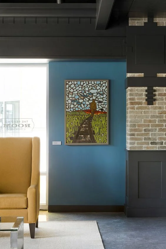 Custom mosaic artwork by Caron Bell depicts a nature scene, evoking images and personal connections to both sky and land. / Image Source: Vela Creative