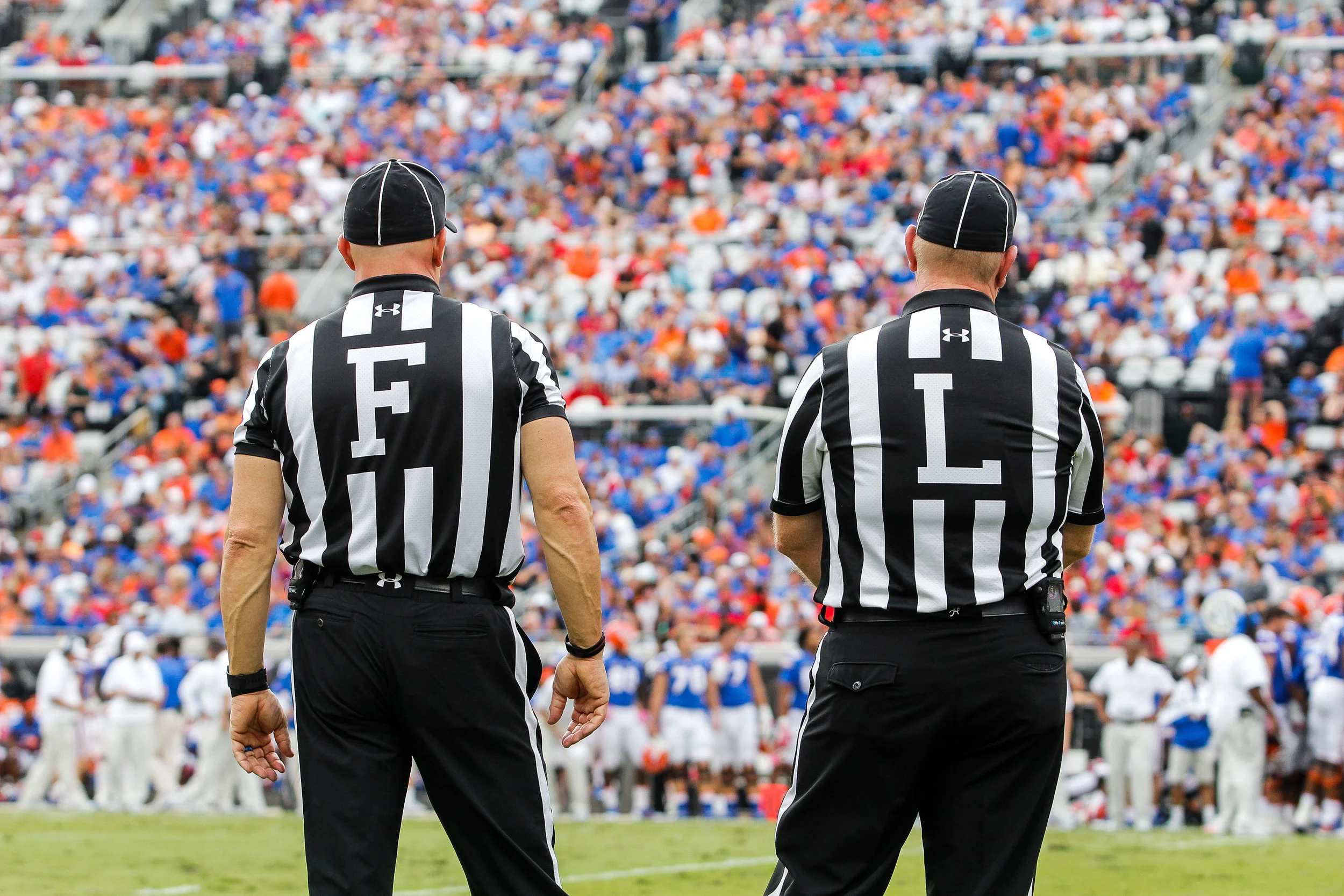 The field judge and the line judge stand on the sideline during a college football game between the University of Georgia and the University of Florida in Jacksonville, Fl., on Saturday, Oct. 28, 2017. The Bulldogs defeated the Gators, 42-7.
