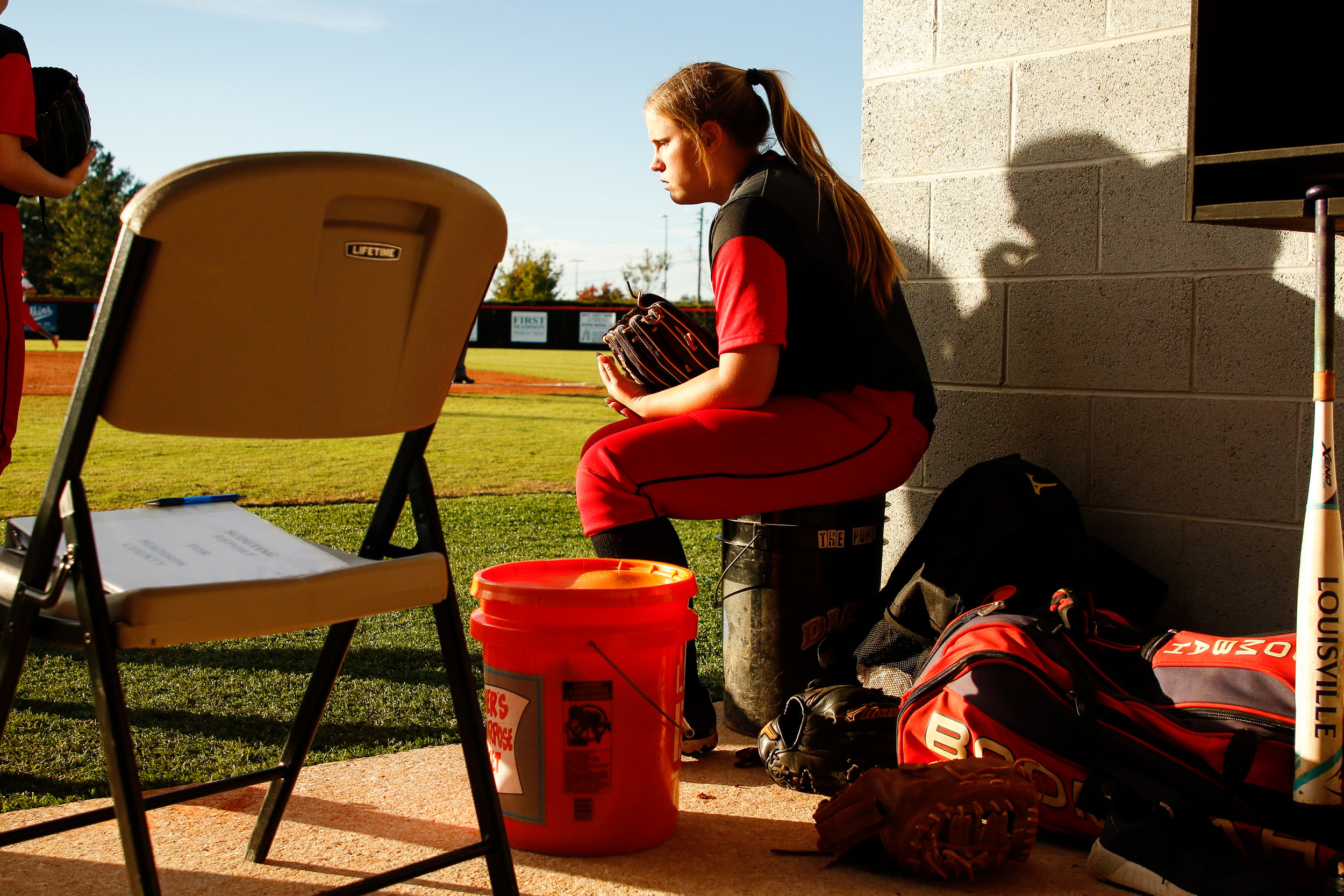 Flowery Branch Amanda Leblanc (36) takes a minute to herself between innings of game one of a second round class 4A playoff series between the Madison County Red Raiders and the Flowery Branch Lady Falcons in Danielsville, Ga., on Wednesday, Oct. 17, 2018. Flowery Branch fell 2-0 to the Raiders.