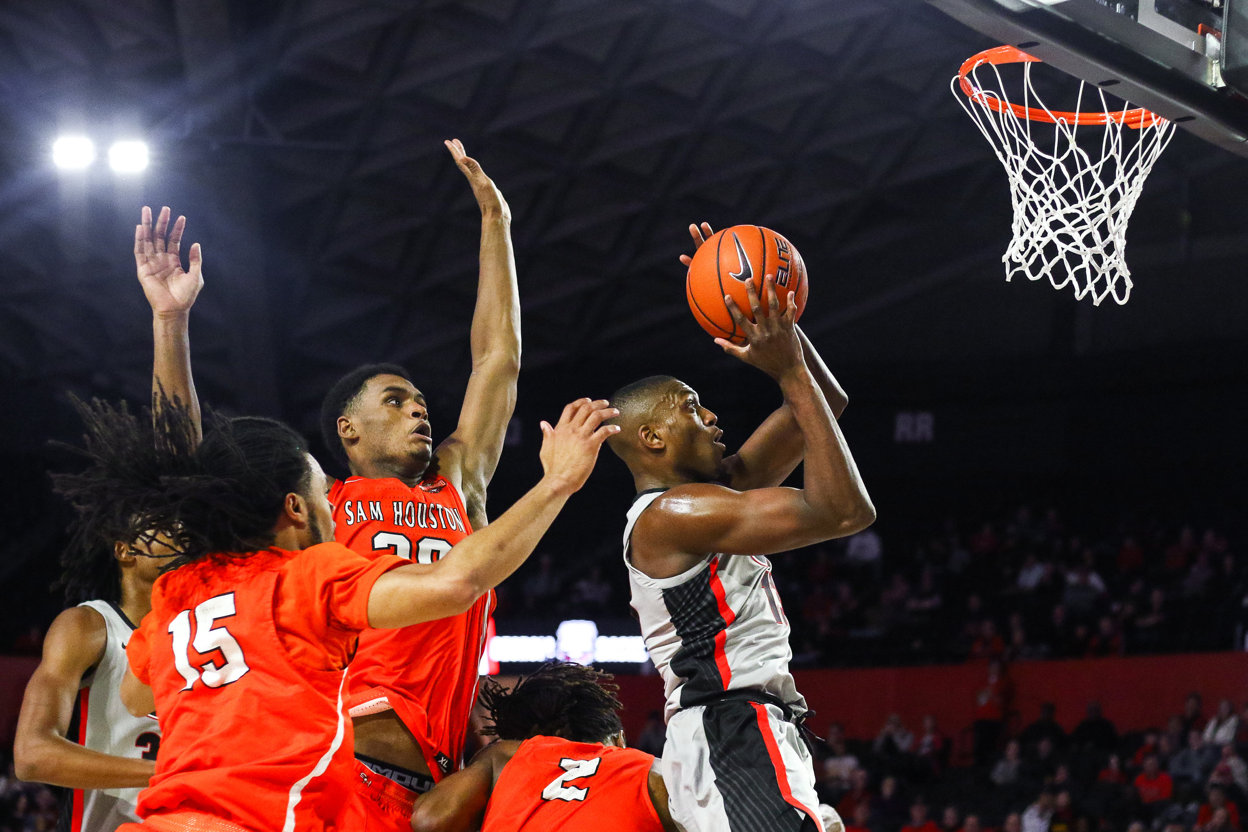 Georgia forward E’Torrion Wilridge (13) attempts a layup as Sam Houston State forward Kai Mitchell (20) reaches for the block during the second half of the men’s basketball game between the Georgia Bulldogs and the Sam Houston State Bearkats in Stegeman Coliseum on Friday, Nov. 16, 2018.