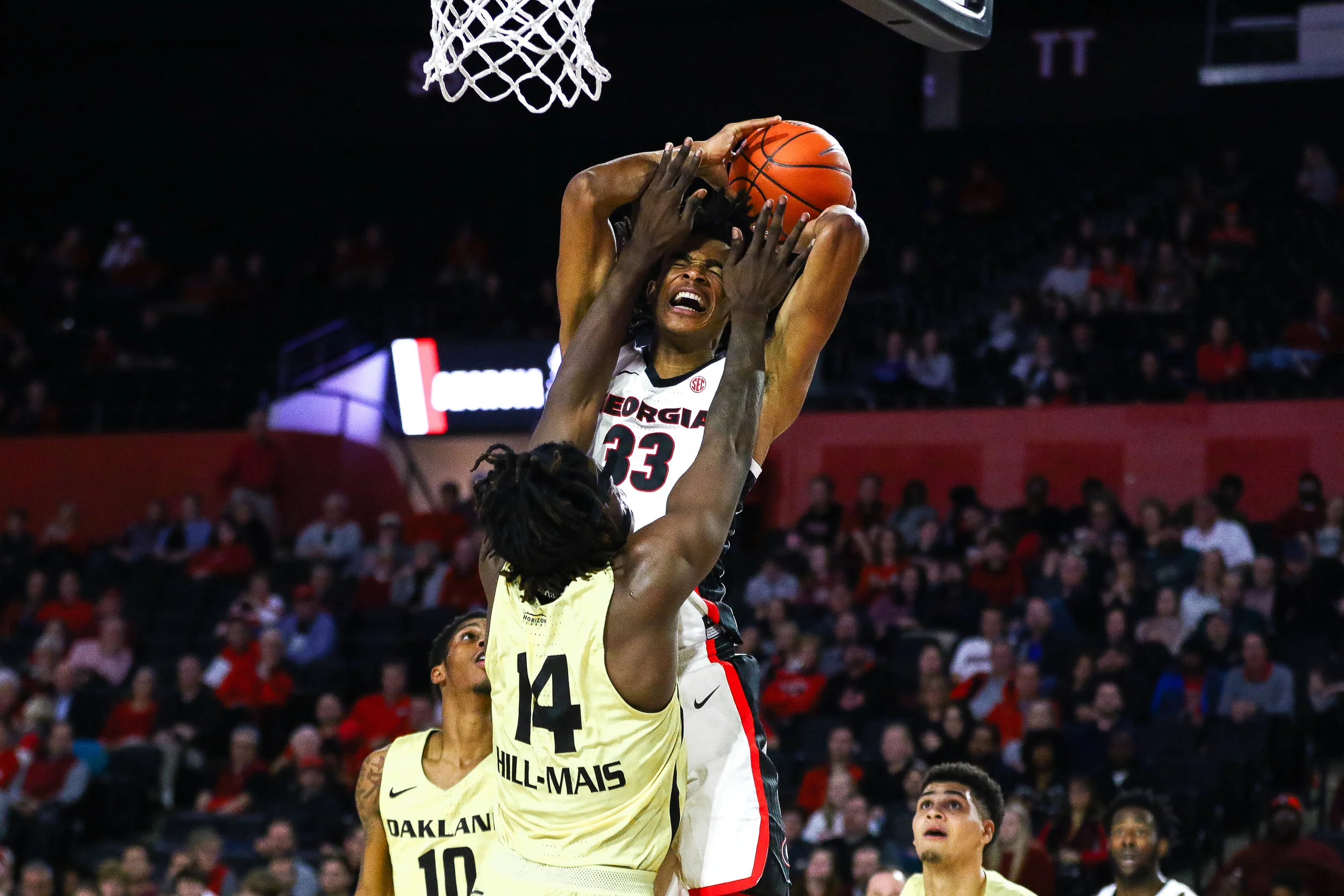 Georgia forward Nicolas Claxton (33) draws a foul during a men's basketball game between the University of Georgia and Oakland University in Stegeman Coliseum on Tuesday, December 18, 2018.