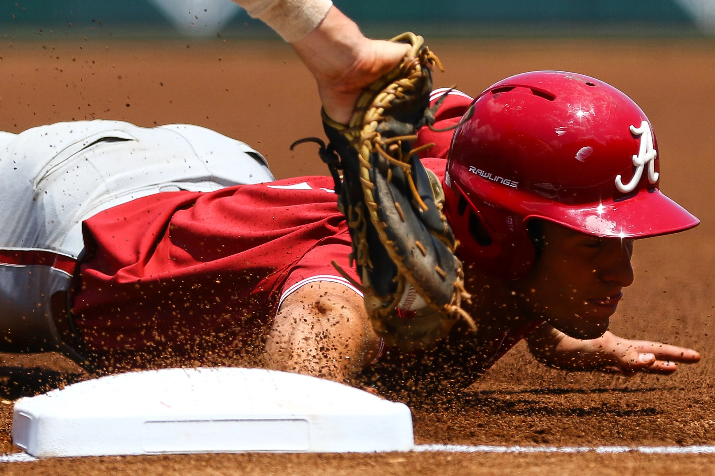 Alabama catcher Brett Auerbach (7) slides to safety during game three of a baseball series between Georgia and Alabama in Athens, Ga., on Saturday, May 18, 2019.