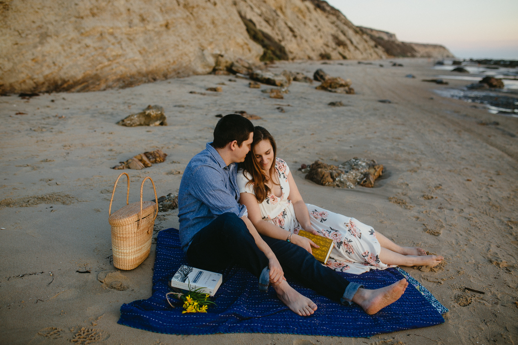 Engaged couple on the sands of Crystal Cove State Park.