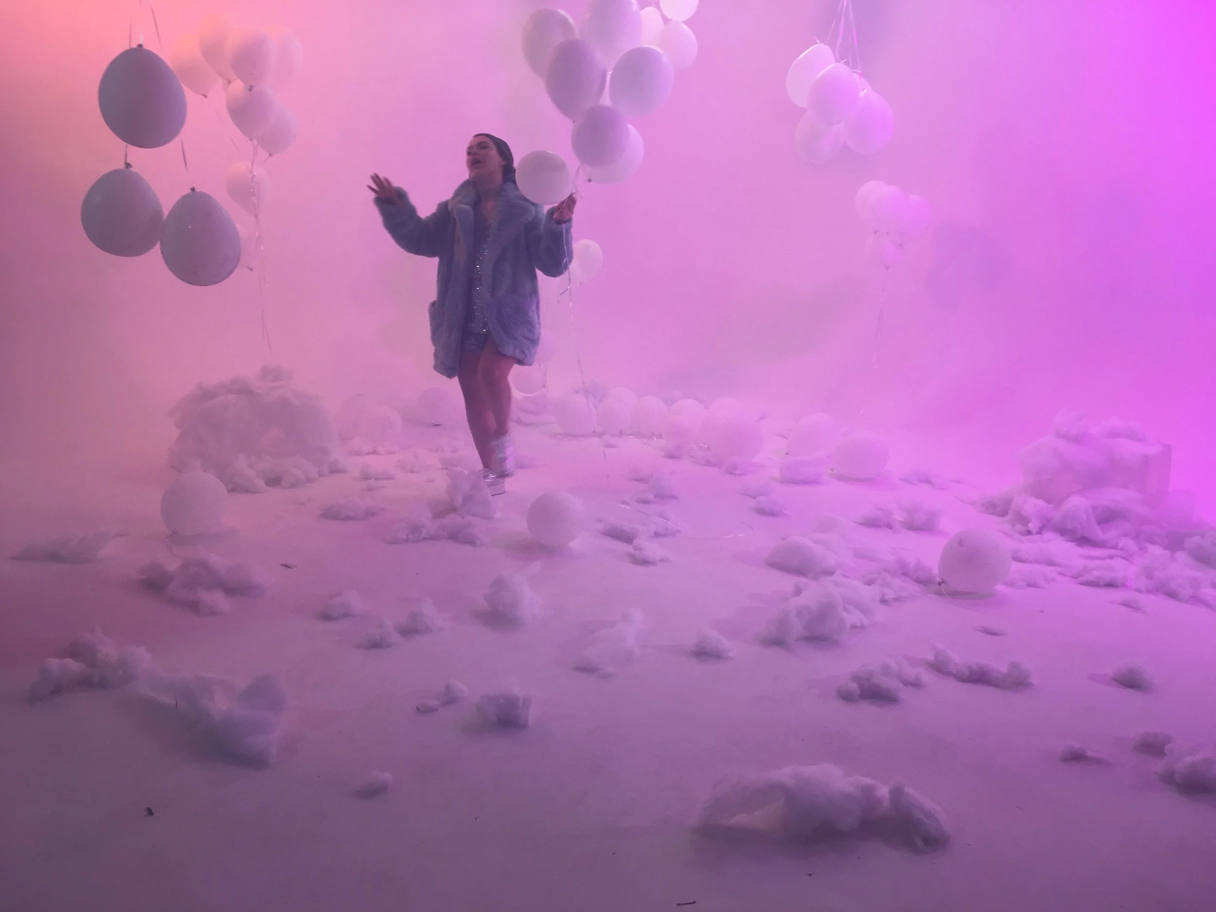 Heaven / Balloon themed room with helium balloons floating up and air filled balloons hanging down. Picture is on take without industrial fog machine.