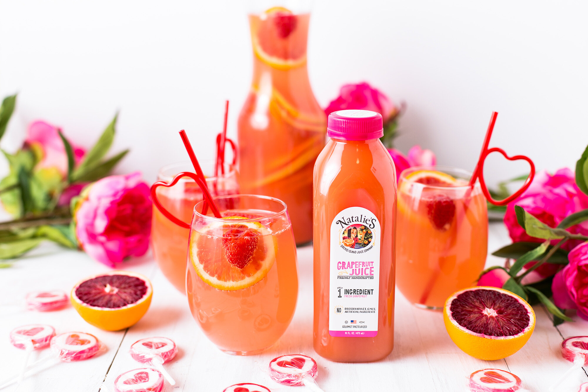   Ingredients   1 750 ml. Bottle dry Rosé 1/2 cup Natalie’s Grapefruit Juice 1/2 cup Vodka 1/4 cup Agave nectar (or sweetener of your choice), to taste 1 cup Fresh strawberries and/or raspberries 1 Blood orange, thinly sliced 1 Red grapefruit, thinly