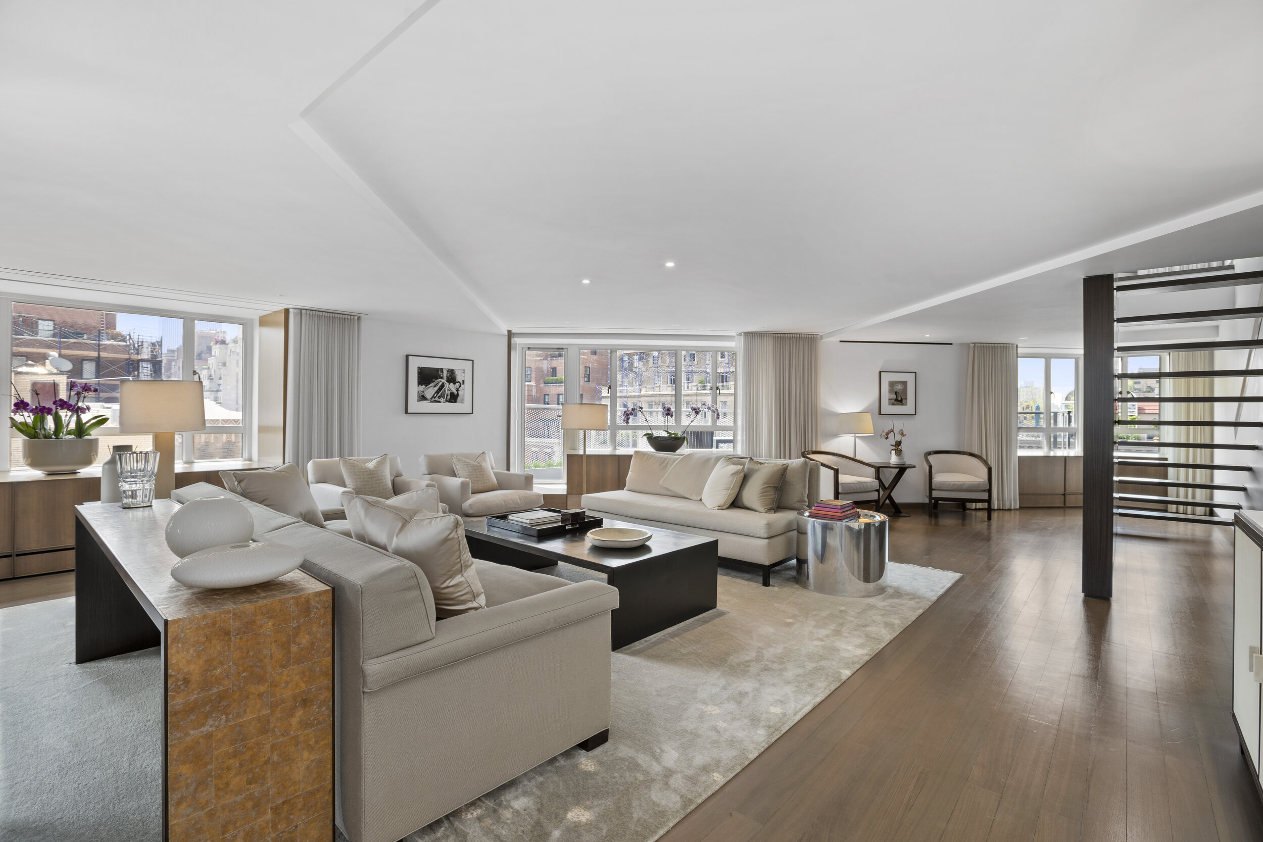  The home has a sprawling double-living room with open south and west exposures and access to a decked terrace with views of Park Acenue and Central Park. There is a large formal dining room, also with access to its own planted terrace – which has an