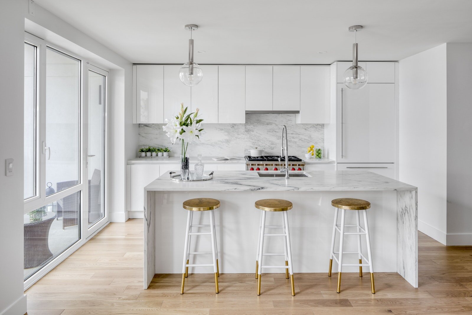   427 East 90th Street Apartment #PH9   The chef's kitchen is thoughtfully designed to offer everything you need for your culinary adventures. The open layout, featuring custom white lacquer cabinetry, honed Montclair Danby marble countertops and an 