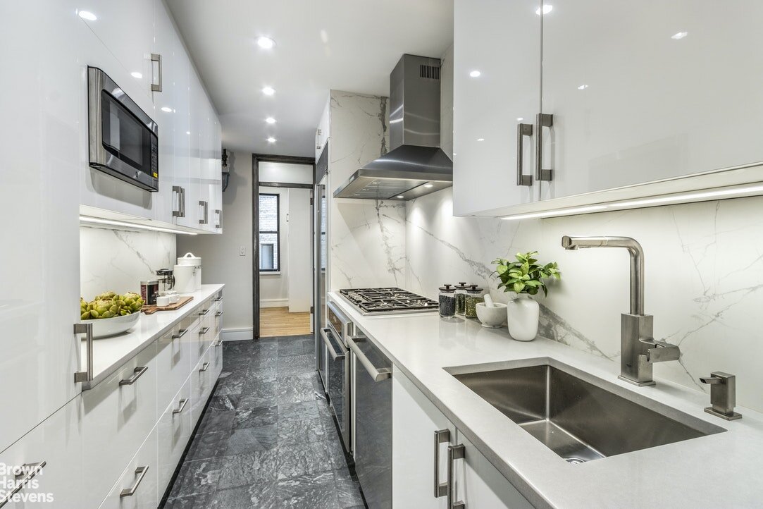   55 East 86th Street Apartment #9C   Be the first to cook in the beautiful eat-in, windowed chef's kitchen equipped with windowed breakfast nook, top-of-the-line appliances, soft close cabinetry and under cabinet lighting. Just off of the kitchen is