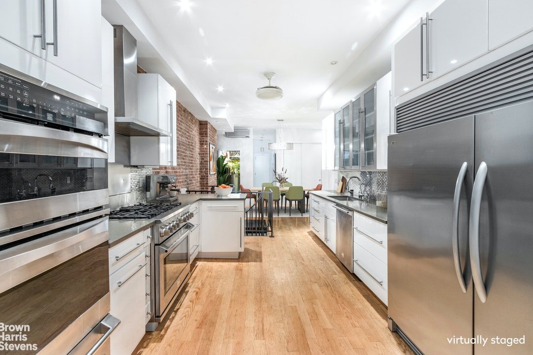   168 East 90th Street Apartment #1E   Space meets function in this fantastic sprawling duplex! In an apartment that feels like a house, you can work from home, entertain friends on your private patio, cook a delicious meal in your gourmet kitchen, o