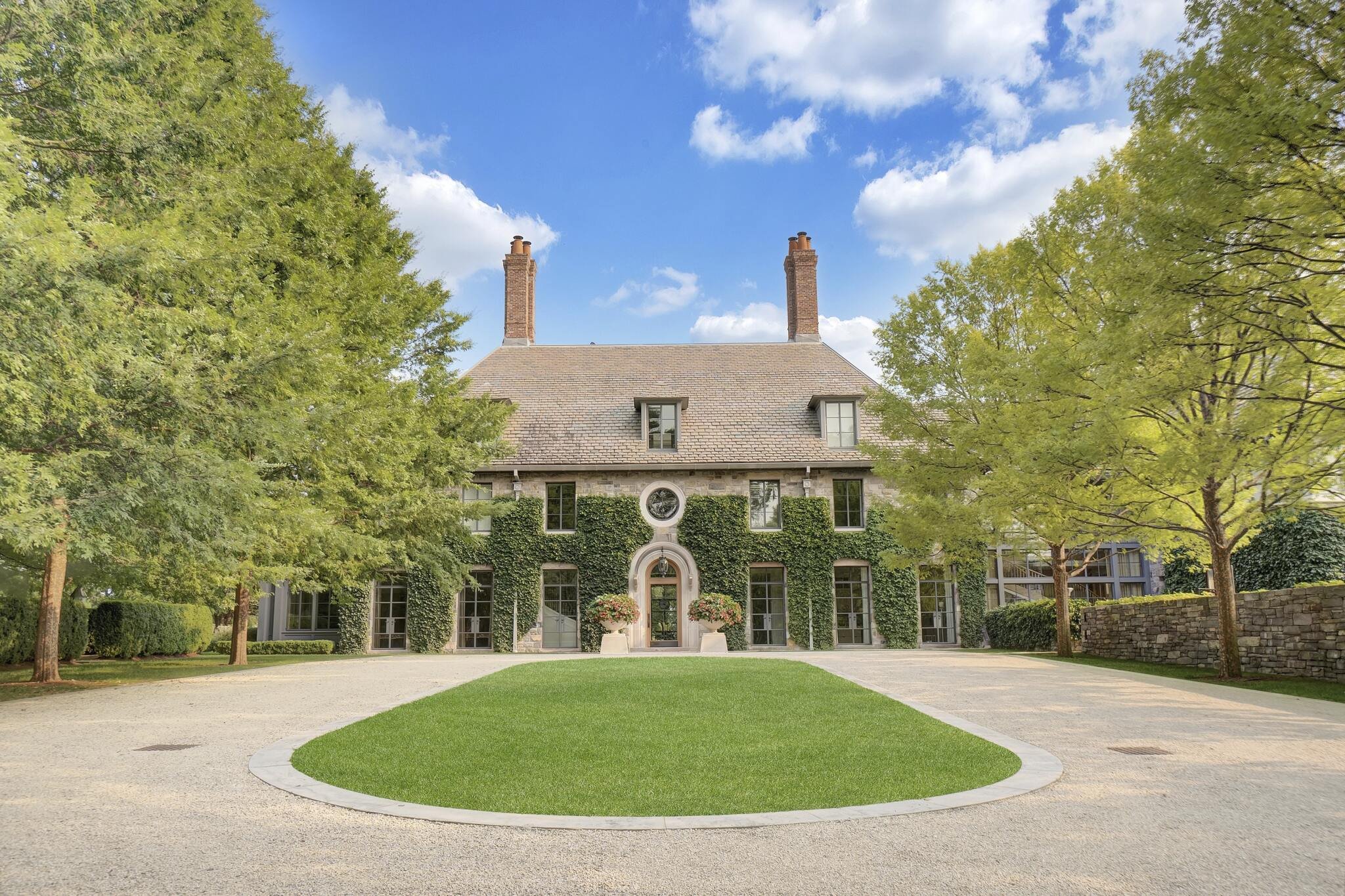  Built in 2008, the 16,359-square-foot mansion with 7-bedrooms and 9 ½ bathrooms on 5+ gated acres is known for its classic design, hilltop views of Long Island Sound, and underground tunnel which takes you to a sleek and modern pool house. 