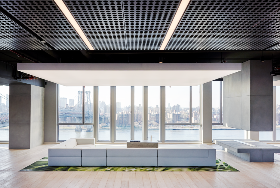    325 Kent    in Williamsburg:  The uniquely modern rental units at 325 Kent are arranged around an elevated courtyard that looks out through a dramatic opening to reveal permanent unobstructed views of Domino Park, the East River and Manhattan skyl