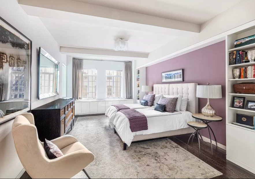  The Northern wing of the home facing East 10th Street offers luxurious living space. The graciously proportioned primary suite encompasses a second fireplace with limestone surround, a large walk-in closet and a spa-like master bathroom featuring do