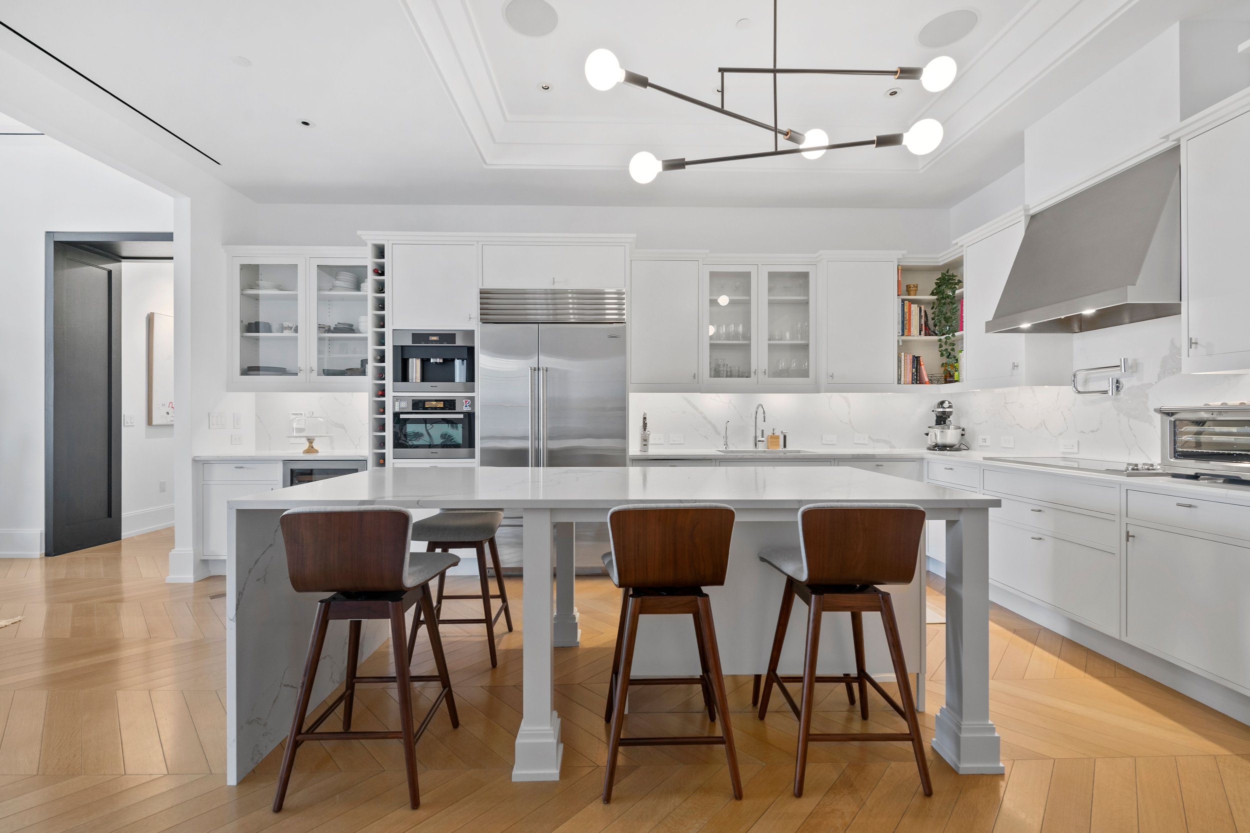  Upon entering this custom home, one is immediately drawn to the oversized tilt-and-turn windows in every room of this almost 3,900 SF corner home with views facing South, West and North. French herringbone oak flooring and up to 12 foot ceilings set