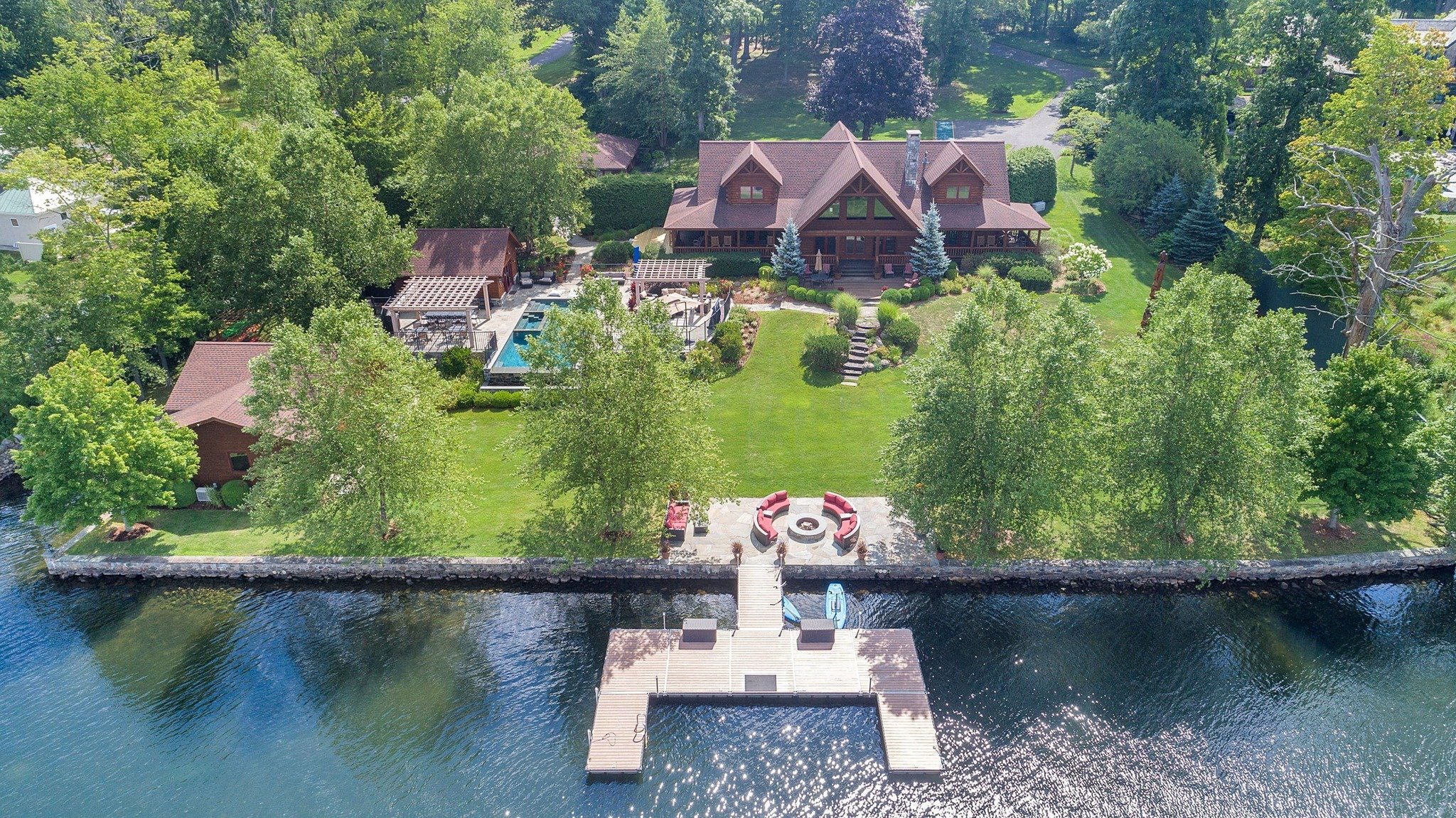  Stunning, turn-key, waterfront compound on 5.94 acres! Exceptionally rare opportunity to own an estate on Lake Quassapaug being sold with all furnishings inside and out, a double-decker pontoon boat, and much more to make this an incredibly easy mov