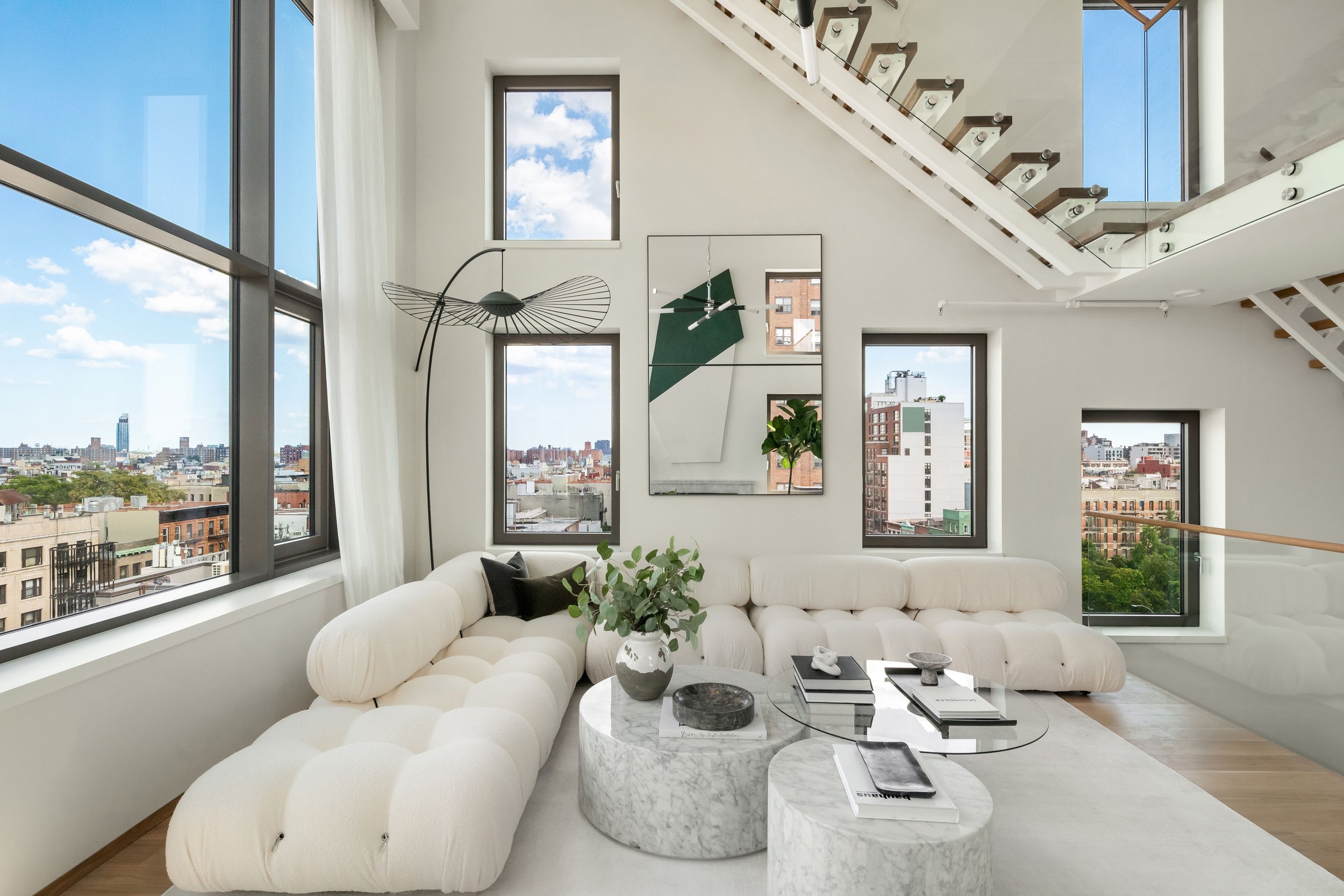  On the third level a large space overlooks the living and dining areas: currently configured as a media room, it could also serve as a gym or home office. Sprawling over 1194' sq. ft., the crowning roof garden includes a kitchen with an electric BBQ